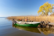 Fishing boat moored at wooden...