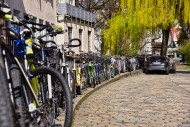 Bicycles parked against a rai...