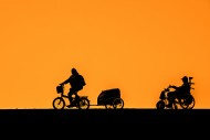 Women riding electric folding...
