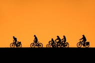 Mother riding on her e-bike /...